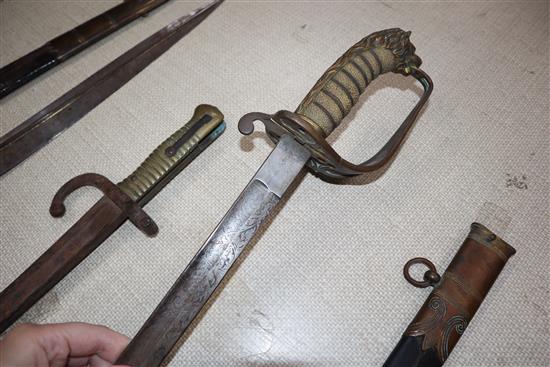 Two officers swords and a bayonet